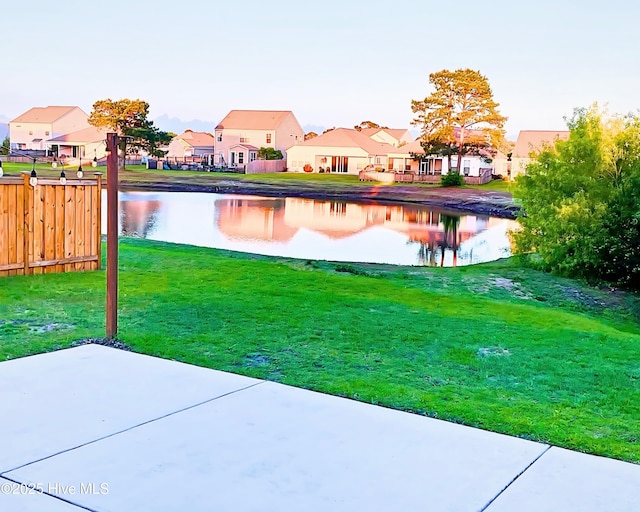 7408 Darius Dr, Wilmington, NC 28411 - view of yard with a water view, a residential view, and a patio area