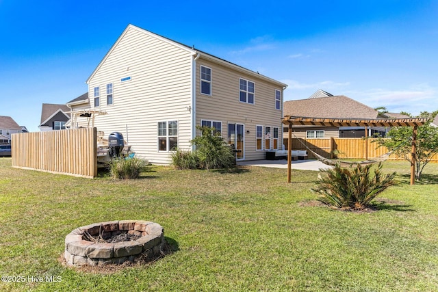 7408 Darius Dr, Wilmington, NC 28411 - back of house featuring a fire pit, a pergola, and a patio area