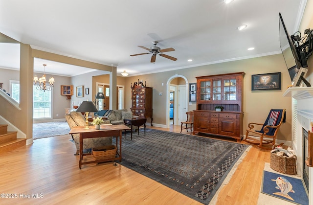 3603 Seafoam Ct, New Bern, NC 28562 - living area featuring baseboards, light wood finished floors, stairs, ornamental molding, and a chandelier