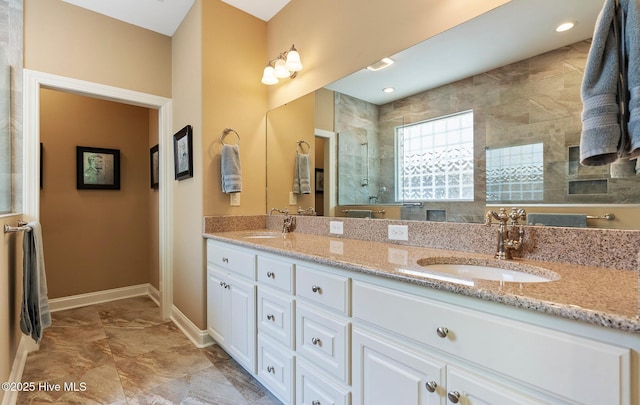 3603 Seafoam Ct, New Bern, NC 28562 - full bath featuring double vanity, a tile shower, baseboards, and marble finish flooring