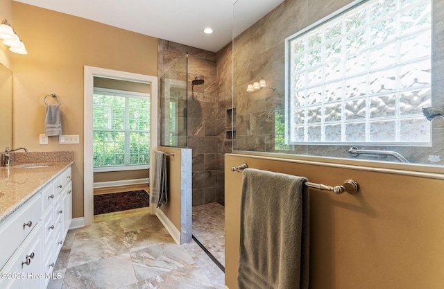 3603 Seafoam Ct, New Bern, NC 28562 - full bath featuring walk in shower, baseboards, marble look tile flooring, double vanity, and recessed lighting