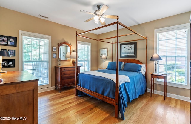 3603 Seafoam Ct, New Bern, NC 28562 - bedroom featuring light wood-style flooring and multiple windows