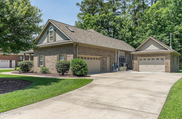 3603 Seafoam Ct, New Bern, NC 28562 - view of front facade featuring brick siding, a front lawn, concrete driveway, a shingled roof, and a garage