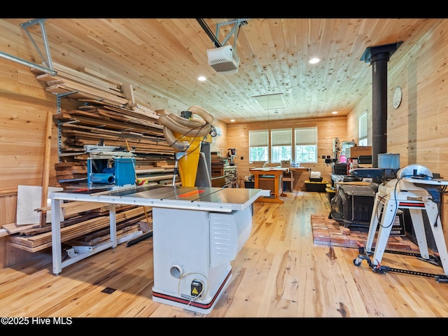 3603 Seafoam Ct, New Bern, NC 28562 - home office featuring a wood stove, wooden walls, light wood-style flooring, recessed lighting, and wood ceiling