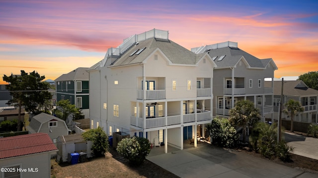 1505 Mackerel Ln Unit 1, Carolina Beach, NC 28428 - view of building exterior with driveway and a residential view
