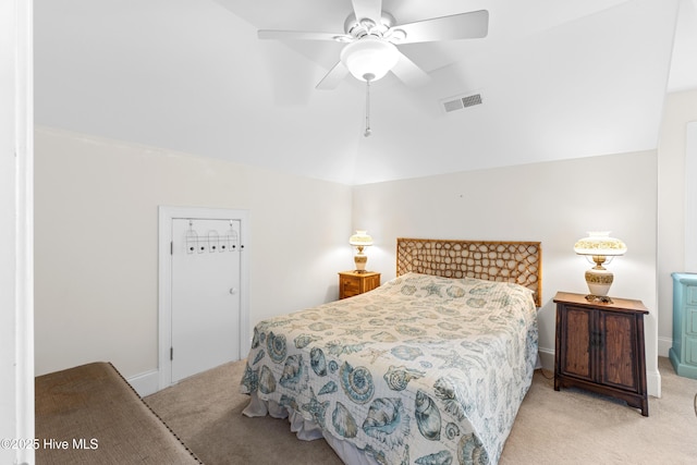 1505 Mackerel Ln Unit 1, Carolina Beach, NC 28428 - bedroom with light carpet, vaulted ceiling, and a ceiling fan