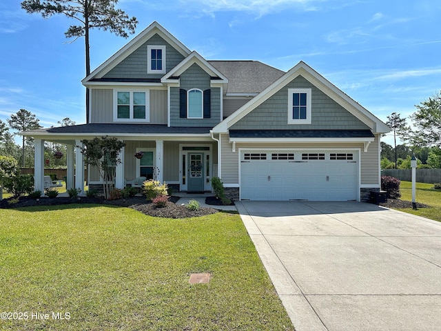 204 Liana Pl, Hubert, NC 28539 - craftsman-style home featuring concrete driveway, stone siding, covered porch, board and batten siding, and a shingled roof