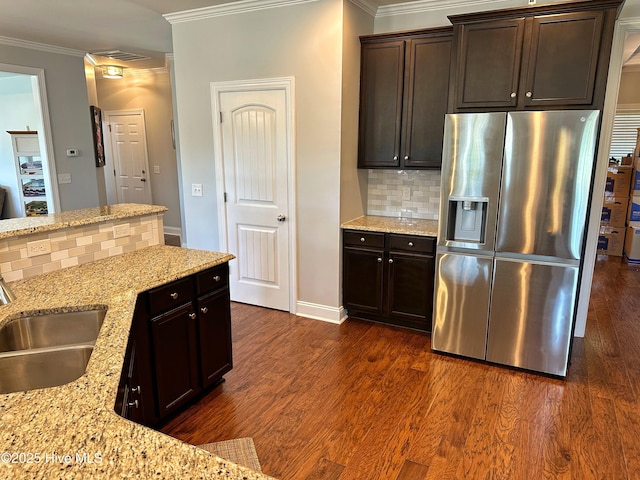 204 Liana Pl, Hubert, NC 28539 - kitchen featuring stainless steel fridge with ice dispenser, ornamental molding, a sink, light stone counters, and tasteful backsplash