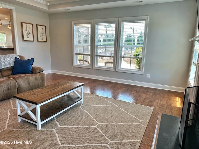 204 Liana Pl, Hubert, NC 28539 - living area featuring plenty of natural light, baseboards, wood finished floors, and ornamental molding