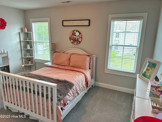 204 Liana Pl, Hubert, NC 28539 - carpeted bedroom featuring multiple windows and baseboards