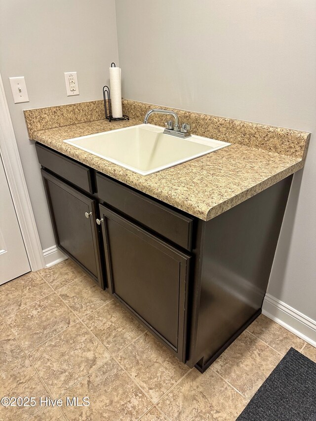 204 Liana Pl, Hubert, NC 28539 - bathroom featuring a sink, baseboards, and tile patterned floors