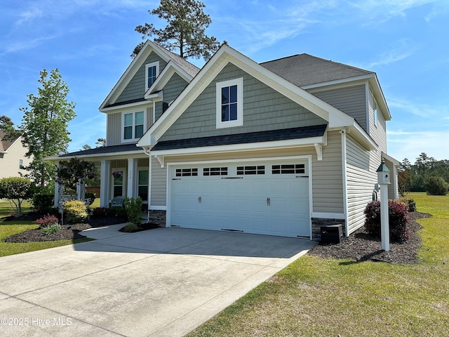 204 Liana Pl, Hubert, NC 28539 - craftsman inspired home with stone siding, driveway, a front lawn, and a shingled roof
