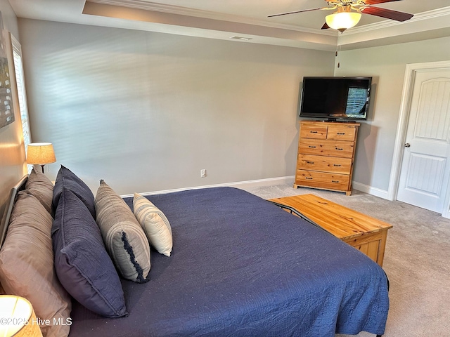 204 Liana Pl, Hubert, NC 28539 - bedroom featuring light carpet, crown molding, a tray ceiling, baseboards, and a ceiling fan