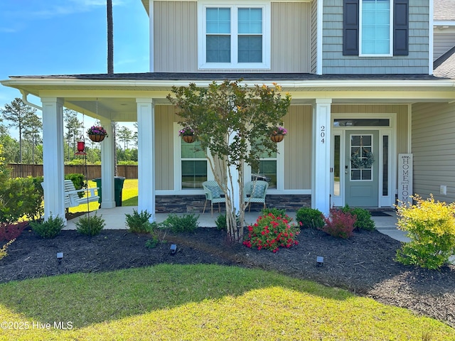 204 Liana Pl, Hubert, NC 28539 - doorway to property with a porch, board and batten siding, and stone siding