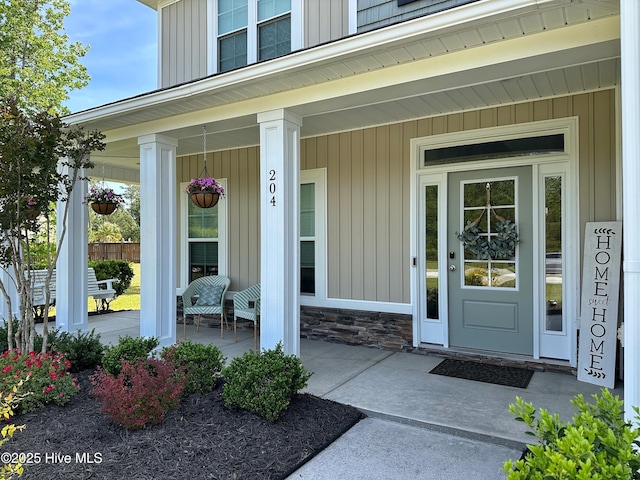 204 Liana Pl, Hubert, NC 28539 - view of exterior entry featuring covered porch and stone siding