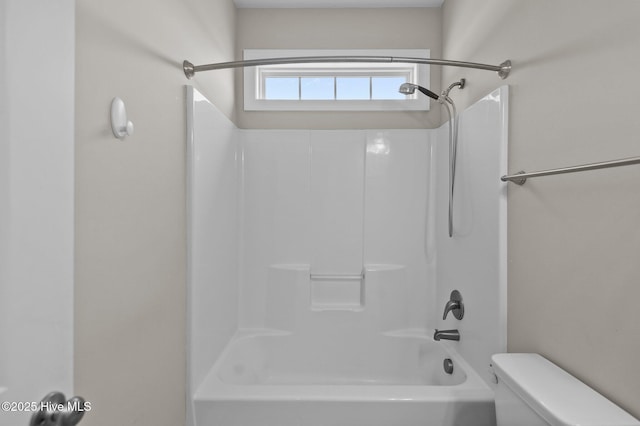 bathroom with toilet and tub / shower combination
