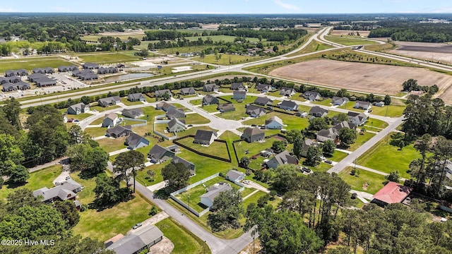 birds eye view of property with a residential view