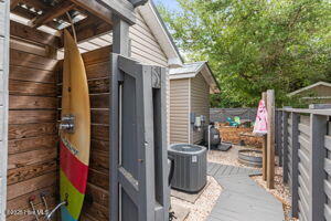 124 NE 15th St, Oak Island, NC 28465 - view of side of home featuring central AC