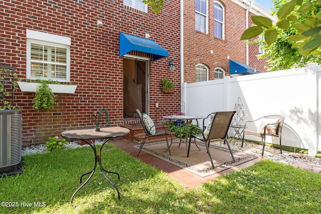 7610 High Market St Unit 3, Sunset Beach, NC 28468 - view of patio / terrace with central AC unit and fence