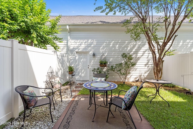 7610 High Market St Unit 3, Sunset Beach, NC 28468 - view of patio featuring fence
