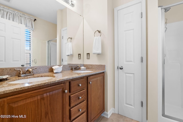 7610 High Market St Unit 3, Sunset Beach, NC 28468 - full bath featuring a shower stall, double vanity, and tile patterned floors