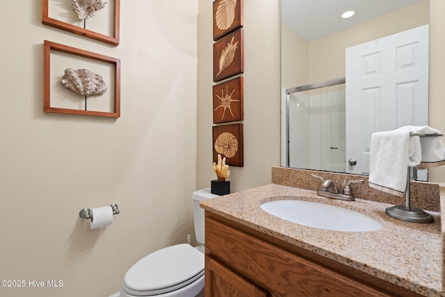 7610 High Market St Unit 3, Sunset Beach, NC 28468 - bathroom with toilet, vanity, an enclosed shower, and recessed lighting