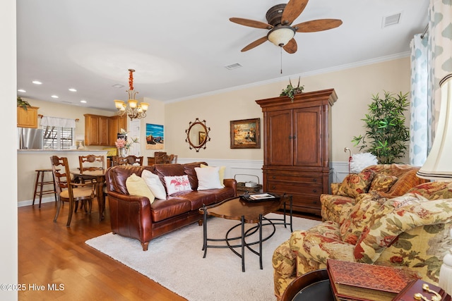 7610 High Market St Unit 3, Sunset Beach, NC 28468 - living area with light wood-style flooring, a chandelier, a ceiling fan, ornamental molding, and recessed lighting