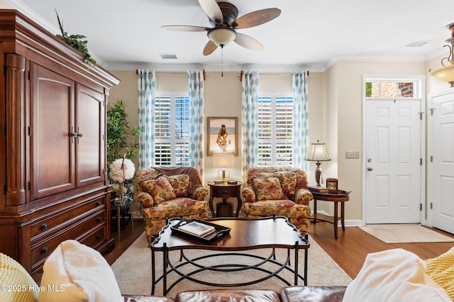 7610 High Market St Unit 3, Sunset Beach, NC 28468 - living room with wood finished floors, healthy amount of natural light, ceiling fan, crown molding, and baseboards