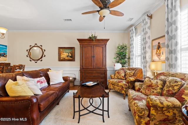 7610 High Market St Unit 3, Sunset Beach, NC 28468 - living area featuring ornamental molding, a ceiling fan, and wainscoting