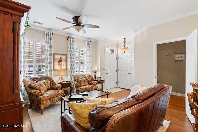 7610 High Market St Unit 3, Sunset Beach, NC 28468 - living area with a ceiling fan, crown molding, wood finished floors, and baseboards