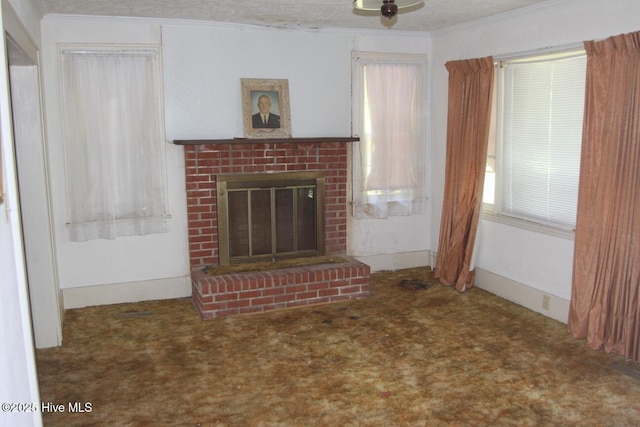 unfurnished living room with crown molding, a brick fireplace, and carpet flooring
