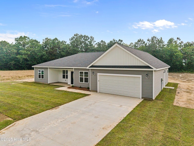 2594 Fountaintown Rd, Chinquapin, NC 28521 - view of front of house with concrete driveway and a garage