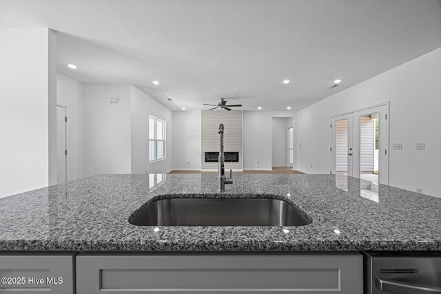 2594 Fountaintown Rd, Chinquapin, NC 28521 - kitchen featuring light stone countertops and white cabinetry