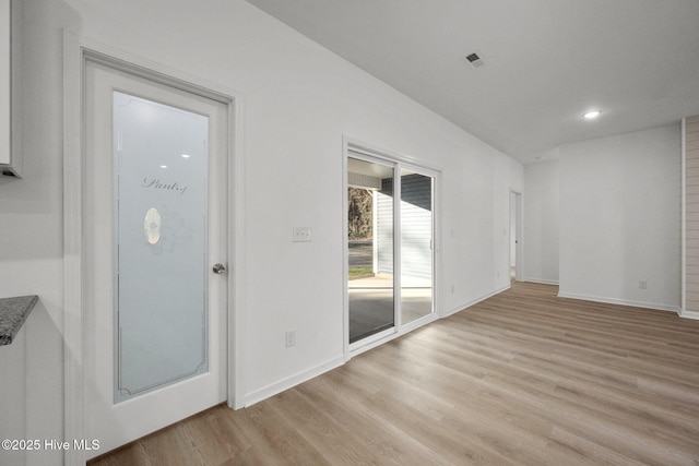 interior space featuring visible vents, recessed lighting, light wood finished floors, and baseboards