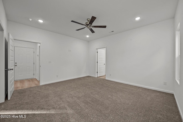 empty room with baseboards, recessed lighting, ceiling fan, and carpet flooring