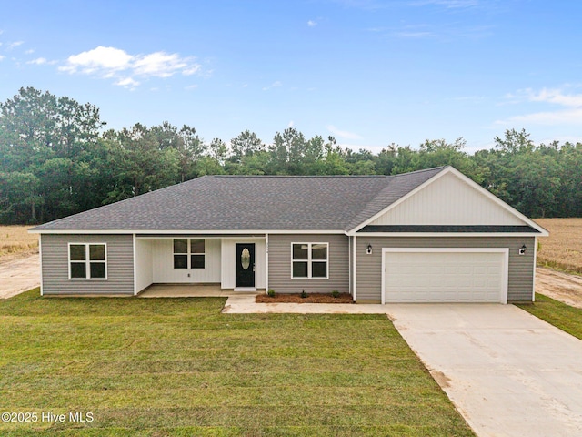 2594 Fountaintown Rd, Chinquapin, NC 28521 - ranch-style home featuring concrete driveway and a garage