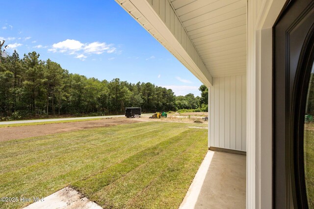2594 Fountaintown Rd, Chinquapin, NC 28521 - back of house featuring a yard, a patio area, and a shingled roof
