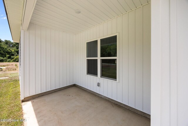 2594 Fountaintown Rd, Chinquapin, NC 28521 - rear view of house featuring a yard, a shingled roof, and a patio area