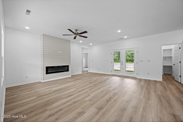 2594 Fountaintown Rd, Chinquapin, NC 28521 - unfurnished living room with ceiling fan, recessed lighting, light wood finished floors, and a large fireplace