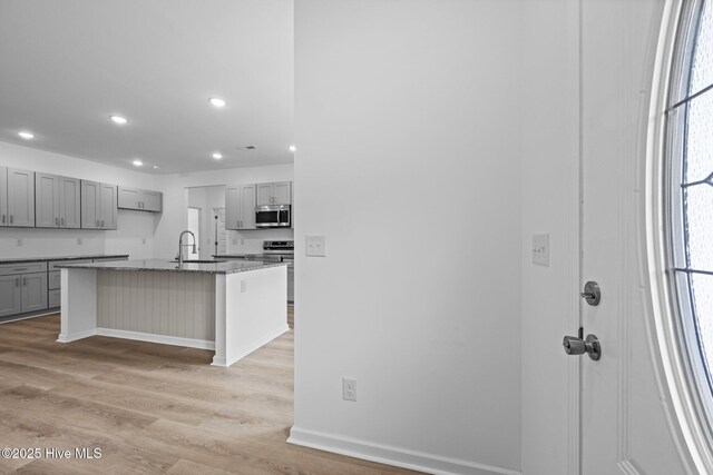 2594 Fountaintown Rd, Chinquapin, NC 28521 - unfurnished living room with recessed lighting, light wood-style floors, a ceiling fan, and a fireplace