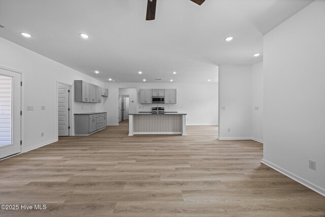 2594 Fountaintown Rd, Chinquapin, NC 28521 - kitchen featuring dishwasher, light wood-style flooring, a ceiling fan, light stone counters, and white cabinets