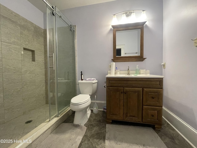 505 N Broad St, Edenton, NC 27932 - bathroom with marble look tile flooring, vanity, baseboards, and a shower stall