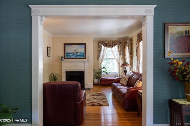 505 N Broad St, Edenton, NC 27932 - living area with wood finished floors, a fireplace, and ornamental molding