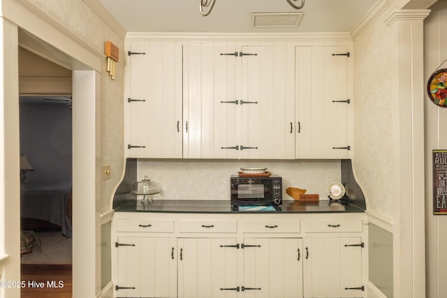505 N Broad St, Edenton, NC 27932 - kitchen with dark countertops and white cabinets