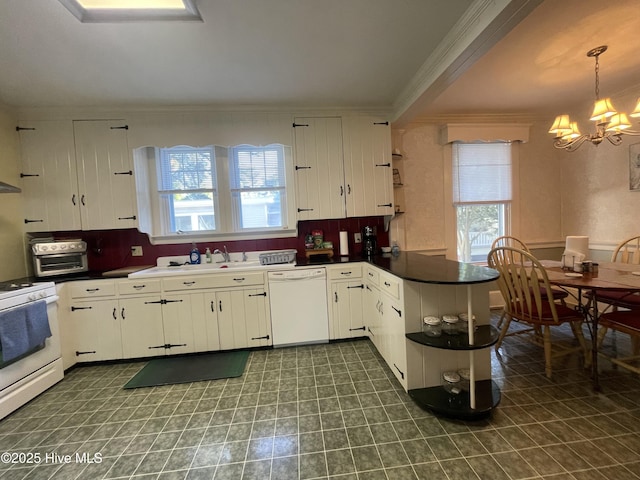 505 N Broad St, Edenton, NC 27932 - kitchen with white appliances, crown molding, a chandelier, a sink, and plenty of natural light