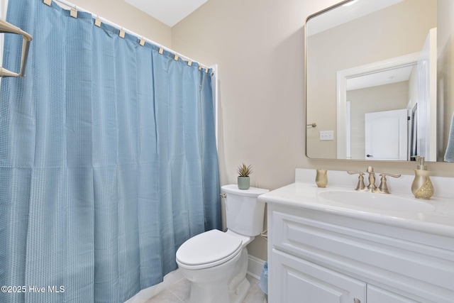 full bath featuring toilet, tile patterned flooring, and vanity