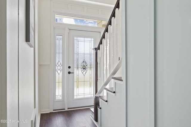 foyer entrance featuring stairway and dark wood finished floors
