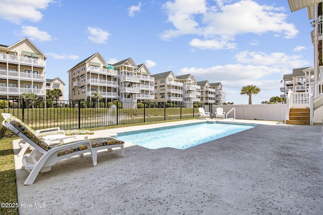 view of pool with fence, a fenced in pool, and a patio area
