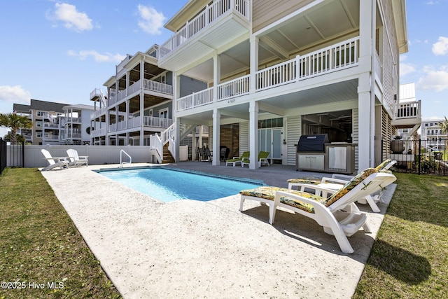 view of pool with fence, stairway, a patio, and a fenced in pool