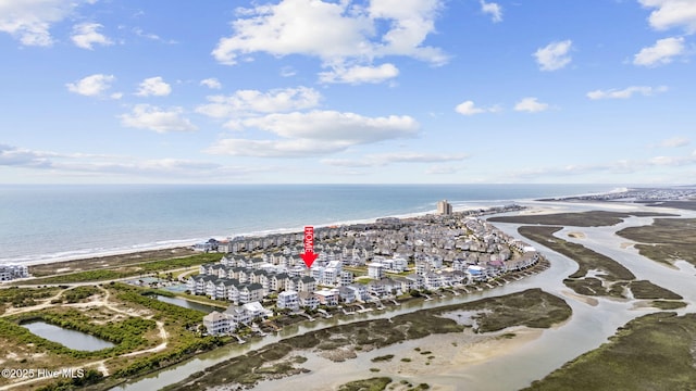 aerial view featuring a view of the beach and a water view